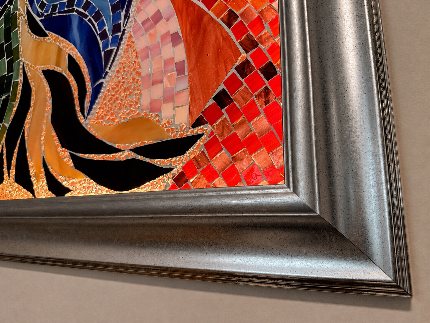 Eye of the Desert — bottom corner, red glass detail